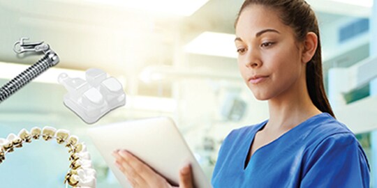Orthodontist reviewing treatment

